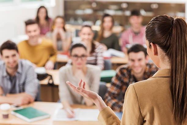 istock Rear view of teacher giving a lecture. 480201354