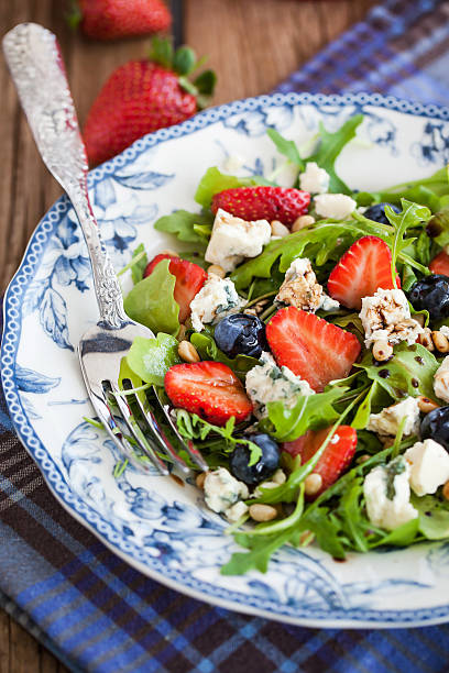 istock Arugula, strawberry, blueberry and blue cheese salad 480201768