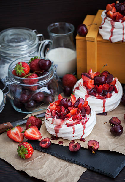 istock Pavlova meringue cake with fresh strawberry and cherry 480203042