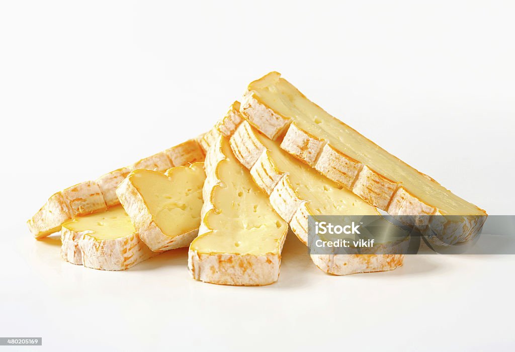 French washed rind cheese Slices of Alsatian Munster cheese Appetizer Stock Photo