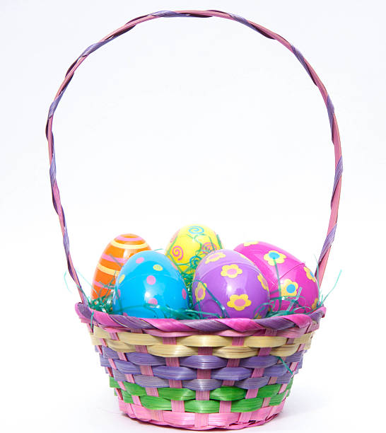 Easter Basket filled with colorful plastic decorative Easter eggs stock photo