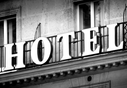 Hotel logo in black and white on a vintage building