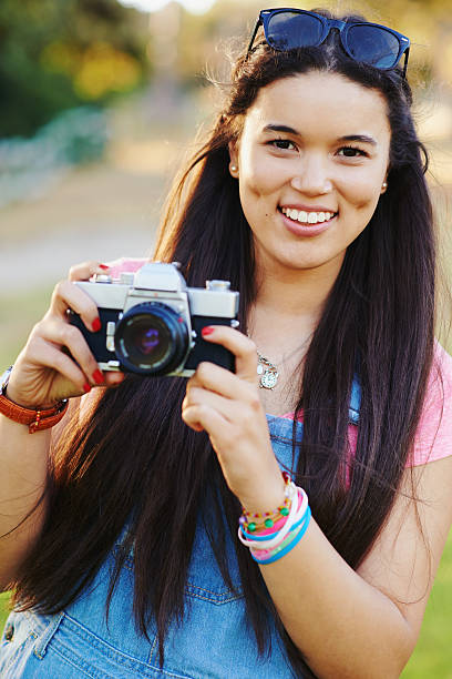 istock Capturing the wonders of the world with her camera 480209148