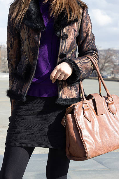 istock Girl holding a handbag 480210799