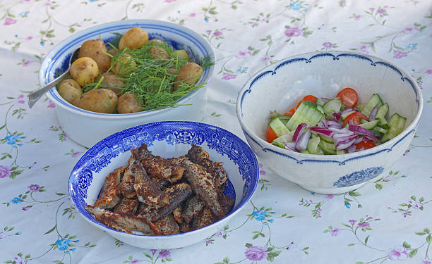 istock Three bowles with herring, potato and sallad 480211394