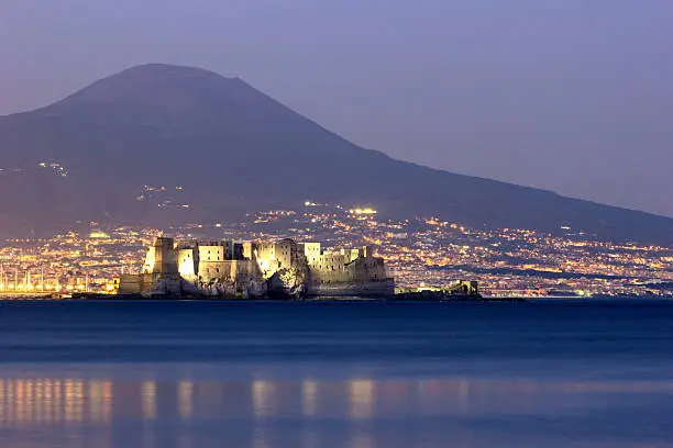Castel dell'Ovo with Mount Vesuvius in the background in Naples in Italy