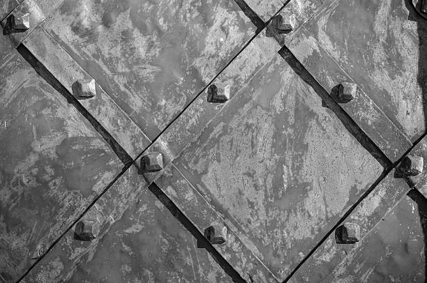 Part of an old iron gate with rivets