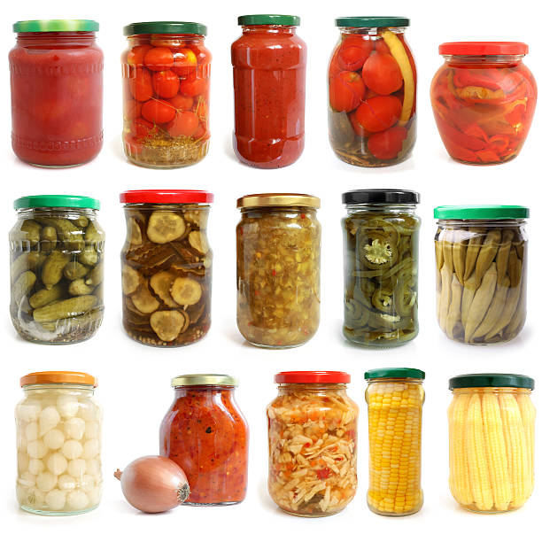 istock Selection of various vegetables canned in glass jars 480212633