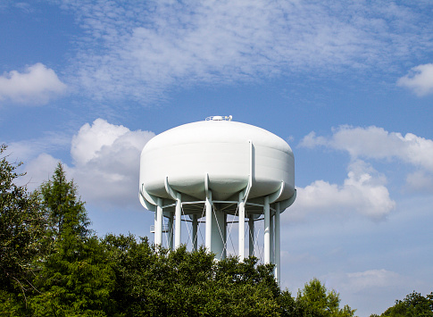 White Water Tower and Blue Sky Background