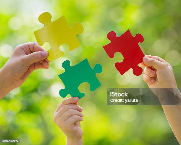 Teamwork And Partnership Stock Photo - Download Image Now - Jigsaw Puzzle, Family, Business