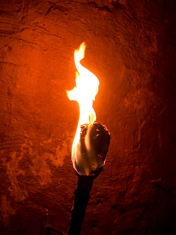 Fire juggler performing at night