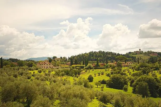 Landscape in Florence, in Italy. Shoot by sunlight. On the picture is green fields and a blue sky.