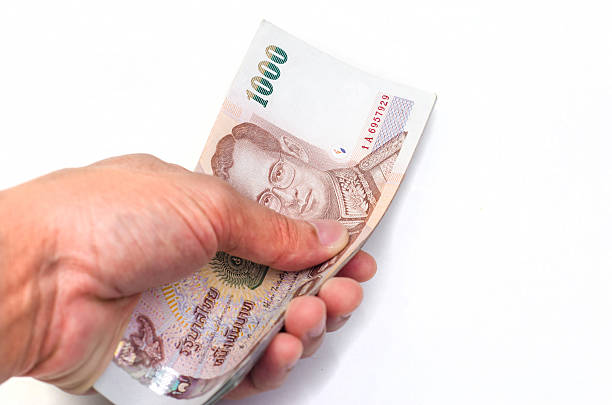 istock Hand sending a bulk of 1000 baht 480218847