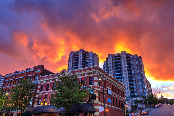 Bloody sunset clouds over buildings Bloody sunset clouds over buildings - it looks like city is on fire new westminster stock pictures, royalty-free photos & images
