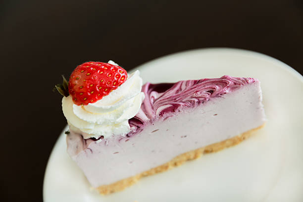 istock Cheesecake with strawberry topping-black background 480223966
