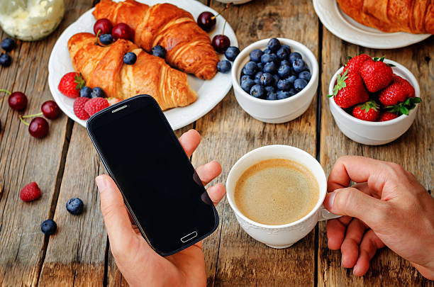 istock Man holding telephone and cup of coffee 480224716