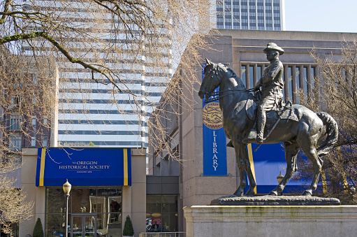 Portland, OR, USA - February 21, 2014: Theodore Roosevelt, Rough Rider statue, and Oregon Historical Society Museum, South Park Blocks