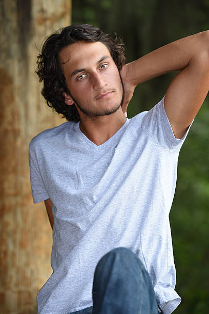 istock Male model with green eyes outdoors 480228288