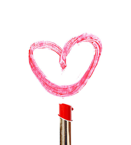 istock lipstick draw heart shape on white background 480230440