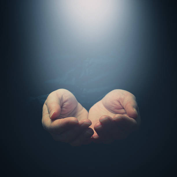 istock Female hands opening to light. Holding, giving, showing concept 480236315