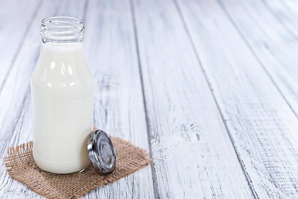 istock Milk on bright wooden background 480236388