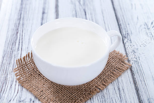 istock Milk on bright wooden background 480236426
