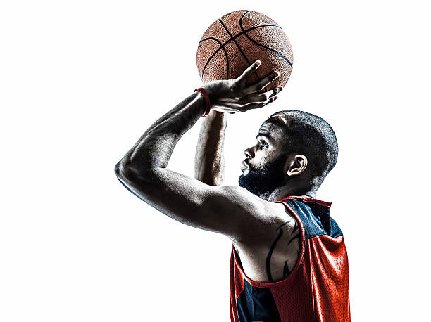 african man basketball player free throw silhouette one african man basketball player free throw in silhouette white background sportsman professional sport side view horizontal stock pictures, royalty-free photos & images