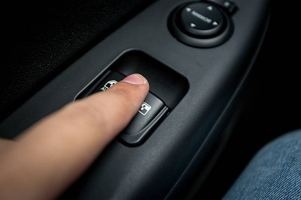 istock Closeup shot of man pressing button controlling window in car 480239920