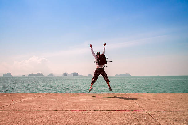 istock Man and sunset hanz with his hands up on 480240430