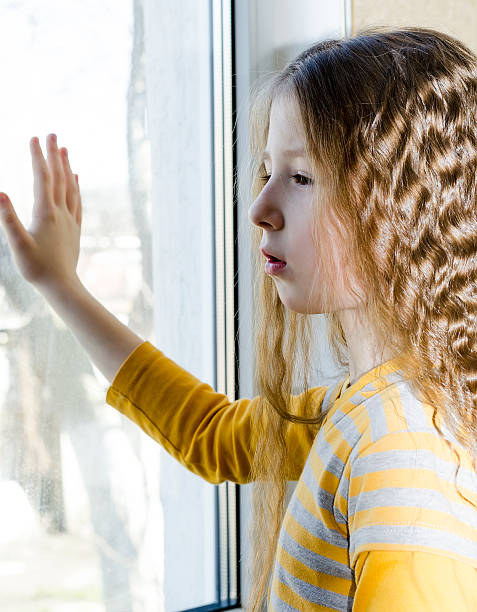 istock the child near a window 480240949