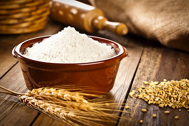 Bowl filled with wheat flour. stock photo
