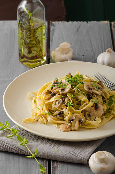 Fettuccine with garlic and mushrooms, olive oil and fresh herbs