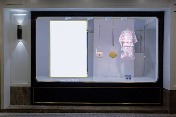 mannequin in fashion shop display window