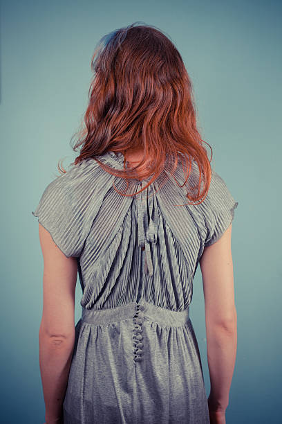 istock Young woman in evening dress 480246341