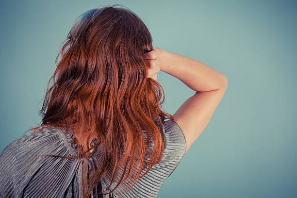 istock Young woman tuching her hair 480246357