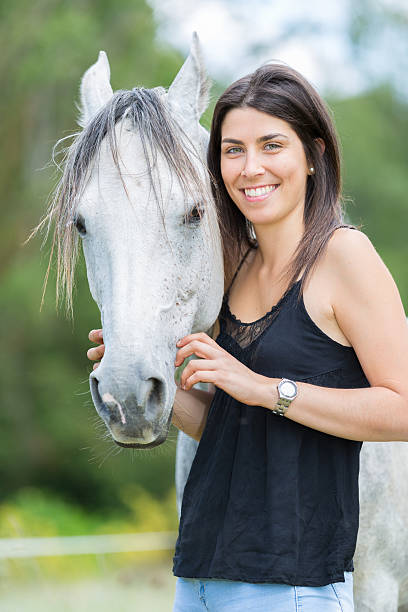 istock Young woman with her horse 480246366