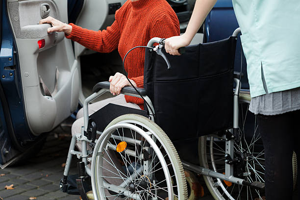 istock Caregiver helping get into the car 480248867