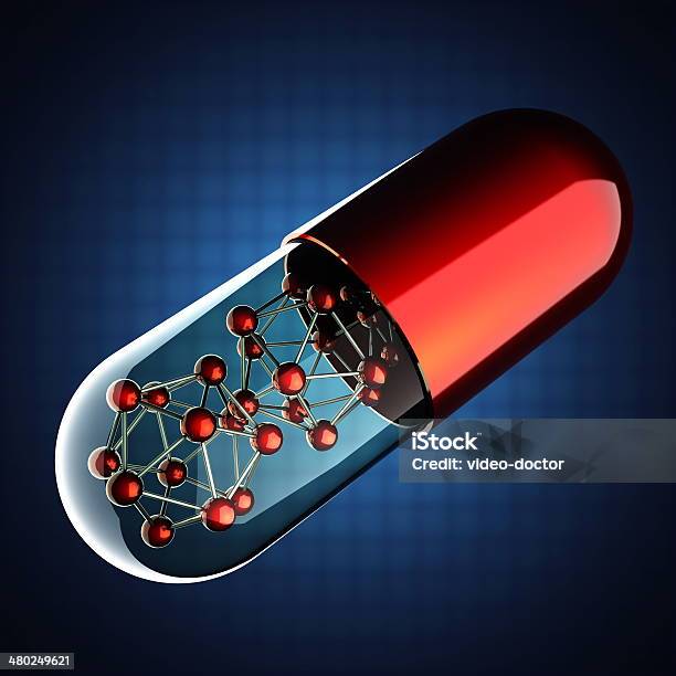 Transparent Capsule On Blue Background Stock Photo - Download Image Now - Antibiotic, Biology, Capsule - Medicine