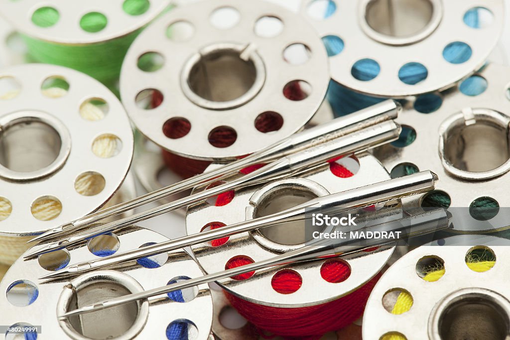 Sewing accessories Metal needles for the sewing machine end metal spools. Equipment Stock Photo