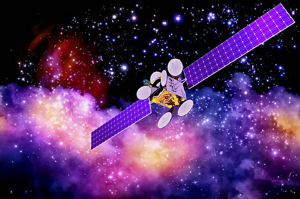 artificial satellite against nebula's background stock photo