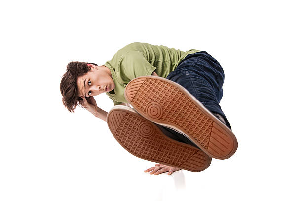 istock Hip hop dancer performing isolated over white 480254789