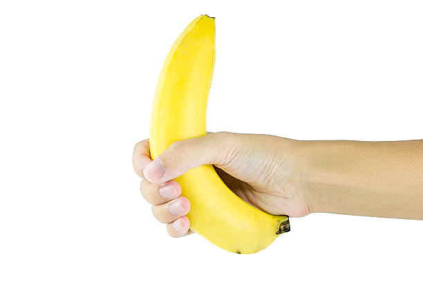 istock Banana in hand on white background 480255616