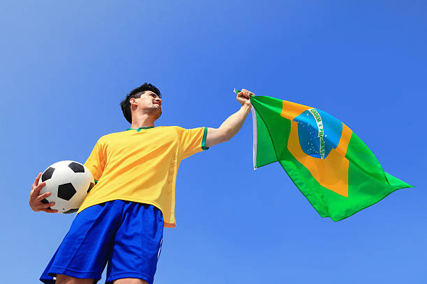 istock Excited man holding a brazil flag 480256089