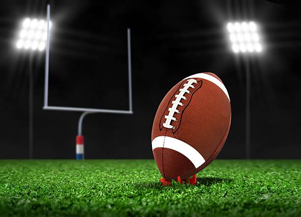 istock Football Ball On Grass under Spotlights 480256177