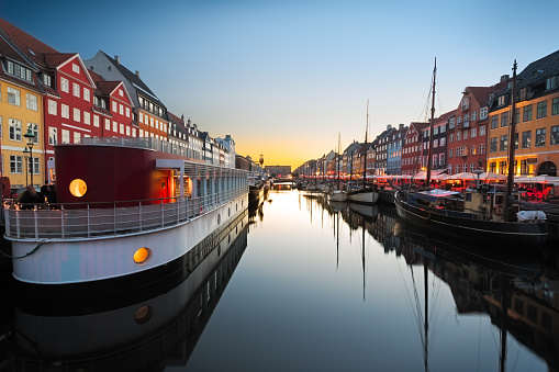 Ships in Nyhaven at sunset, Copenhagen, Denmark