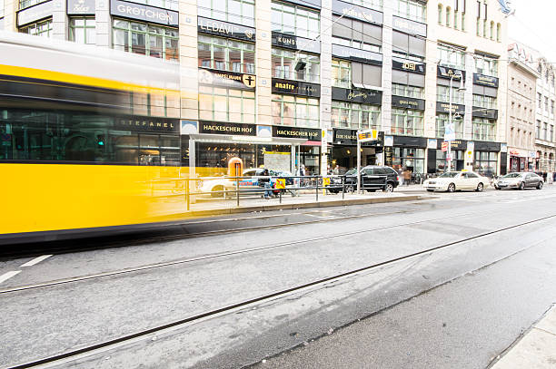 yellow tram Berlin, Germany - September 18, 2013: typical yellow tram on September 18, 2013 in Berlin, Germany. The tram in Berlin is one of the oldest tram systems in the world. central berlin stock pictures, royalty-free photos & images