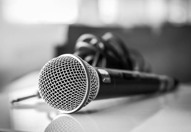 istock Close up of microphone on black and white tone 480259958
