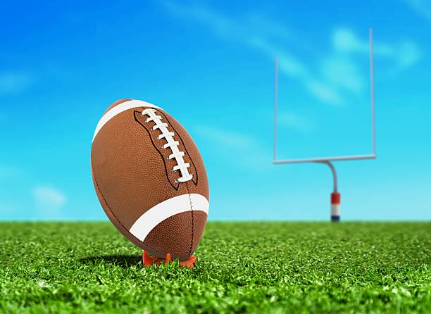 istock Football Ball on Kicking Tee with Goal Post 480259989