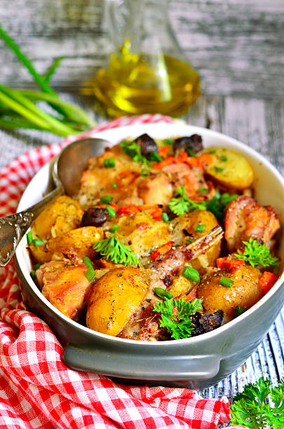 istock Rabbit baked with young potato in a cream. 480262626