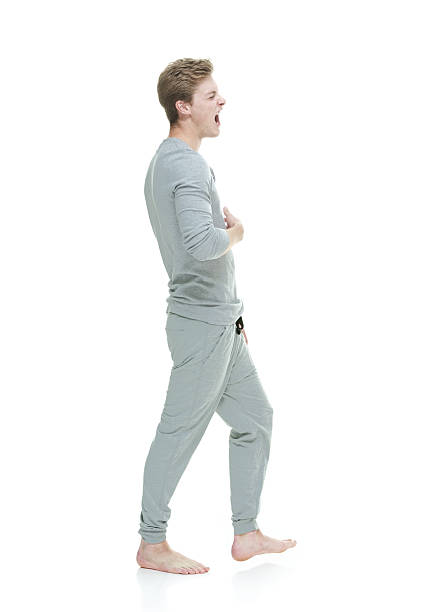 istock Young adult male yawning 480263218